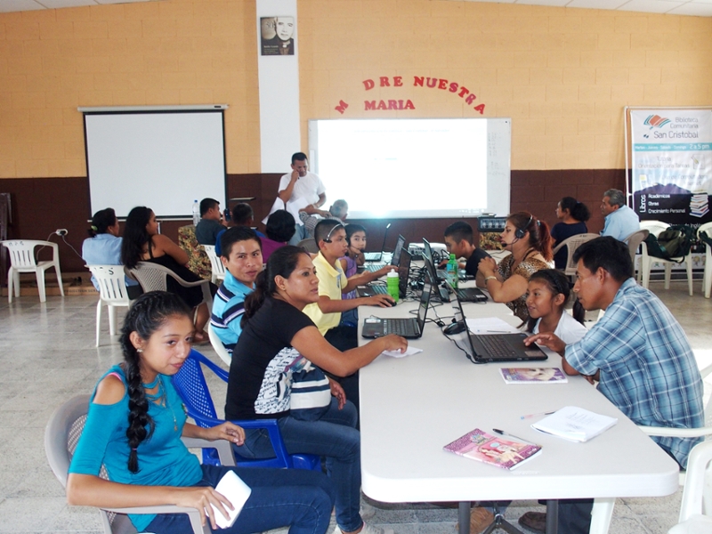 Adult Learners and family members in San Cristóbal use their donated computers. 